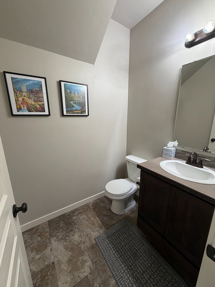 Half bath on first floor, off of kitchen