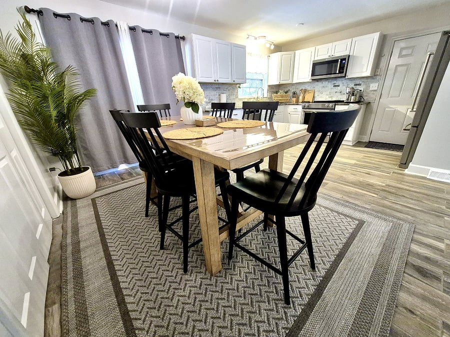 Dining table for six, kitchen beyond