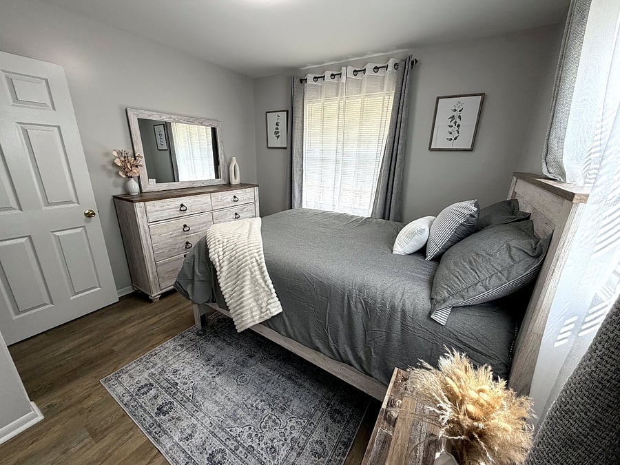 Guest bedroom with dresser and closet