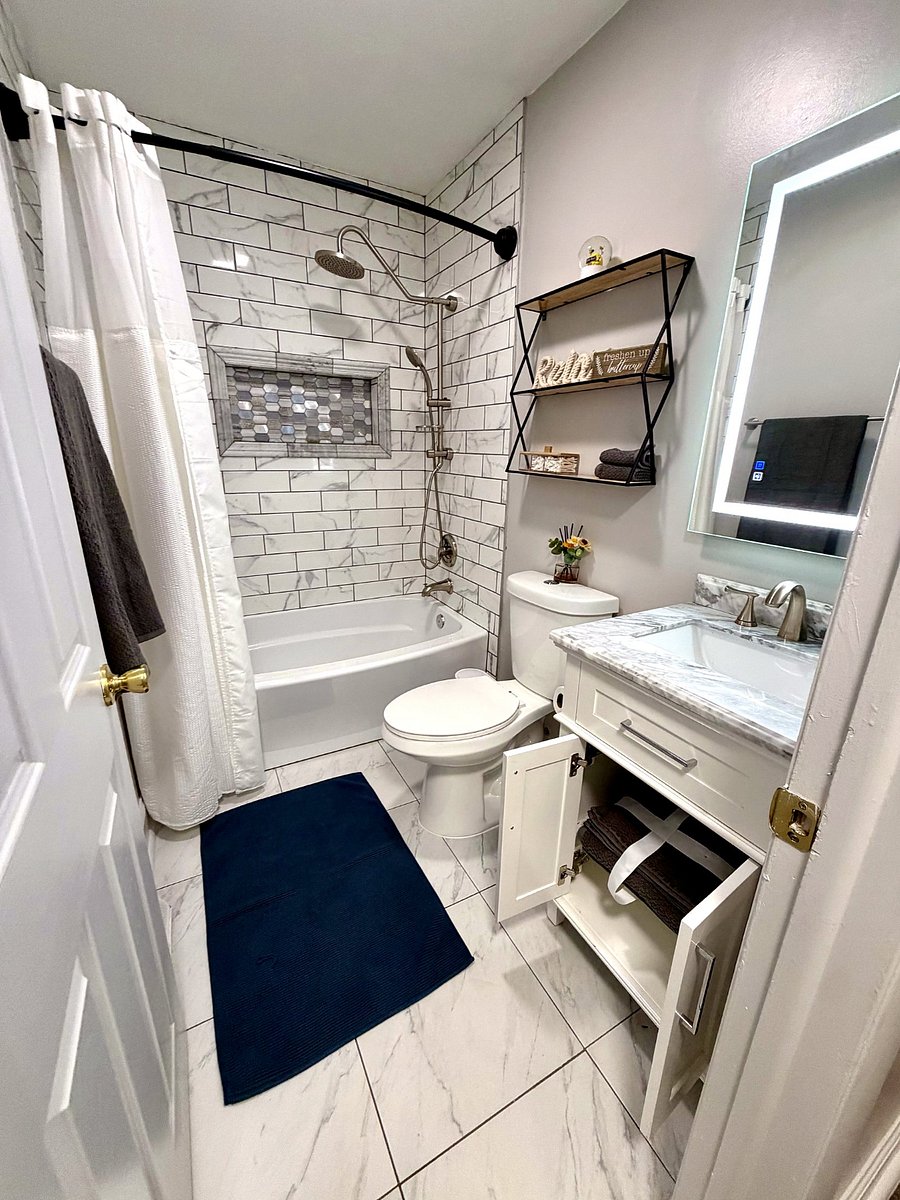 Guest bathroom with tub and rain shower