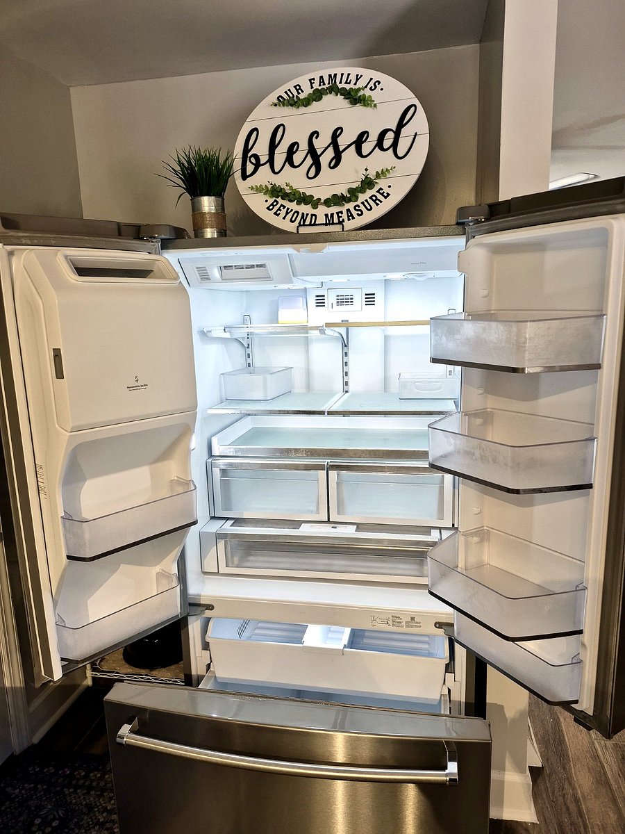Full-size fridge, empty and clean