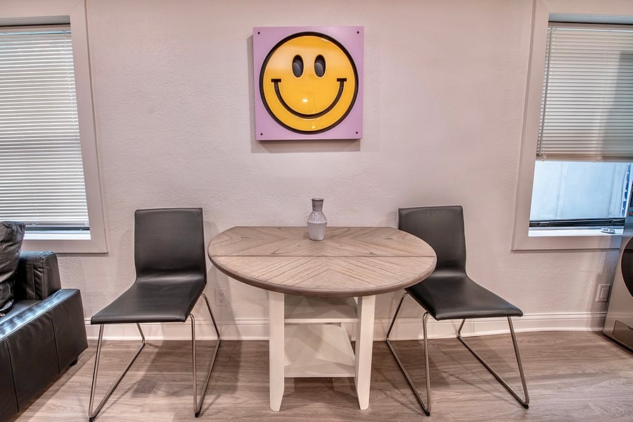 Cozy kitchen vibes with a touch of artistry - enjoy your meals surrounded by the charm of our smiling painting and well-stocked refrigerator!