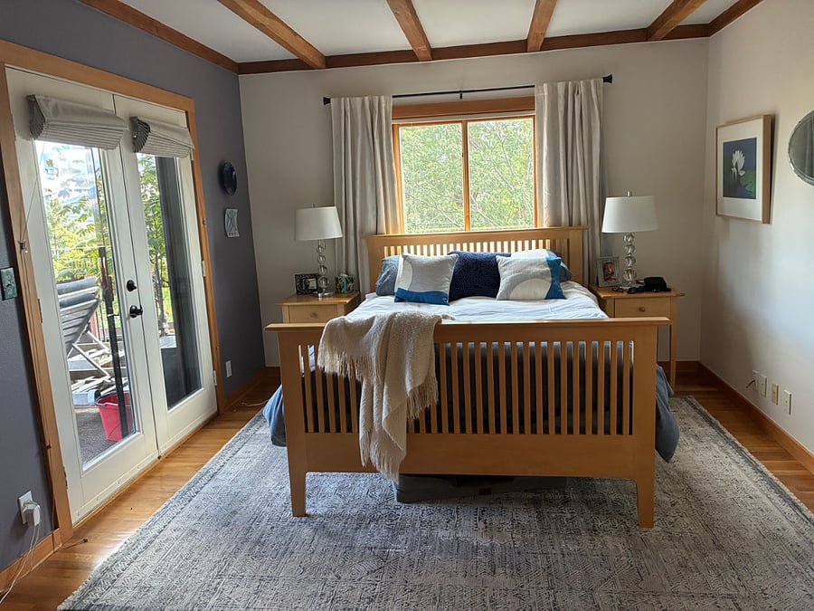 Primary bedrooms with French doors leading to big view deck and hot tub. 