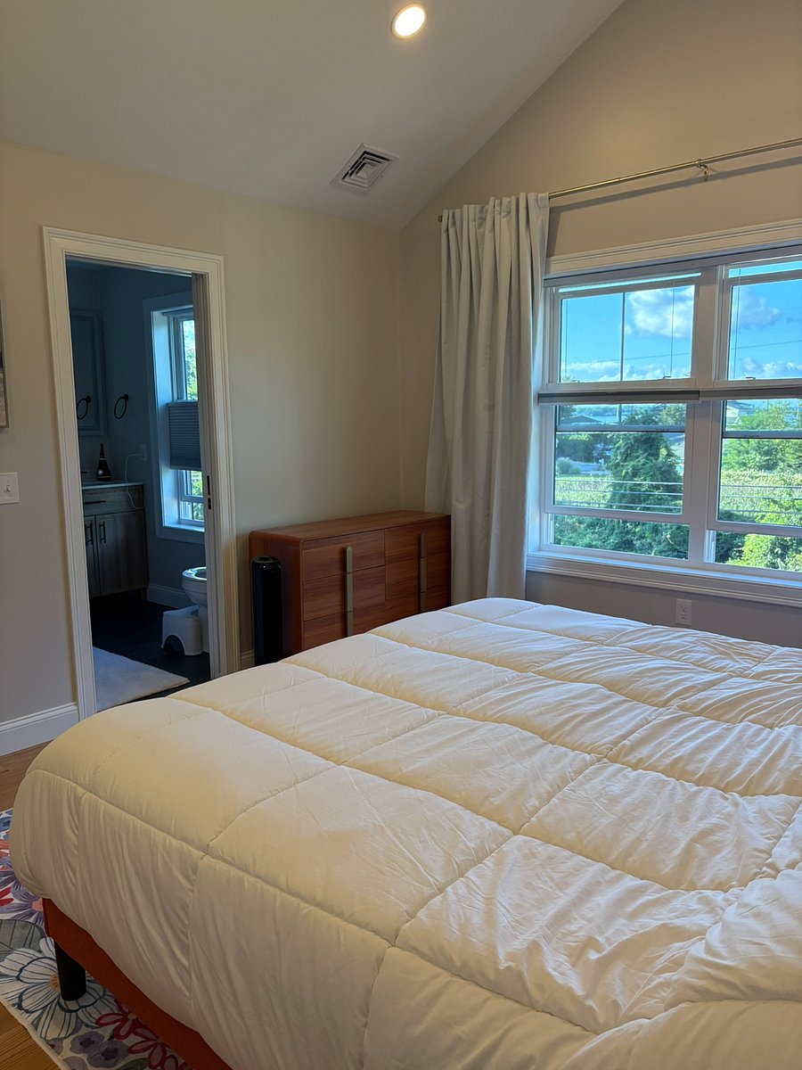 Small dresser in primary, view from walk in closet