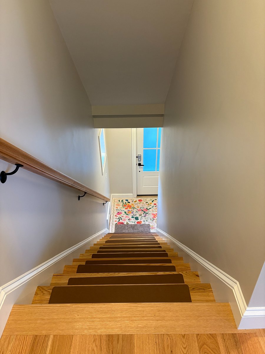 Stairs from kitchen to front door
