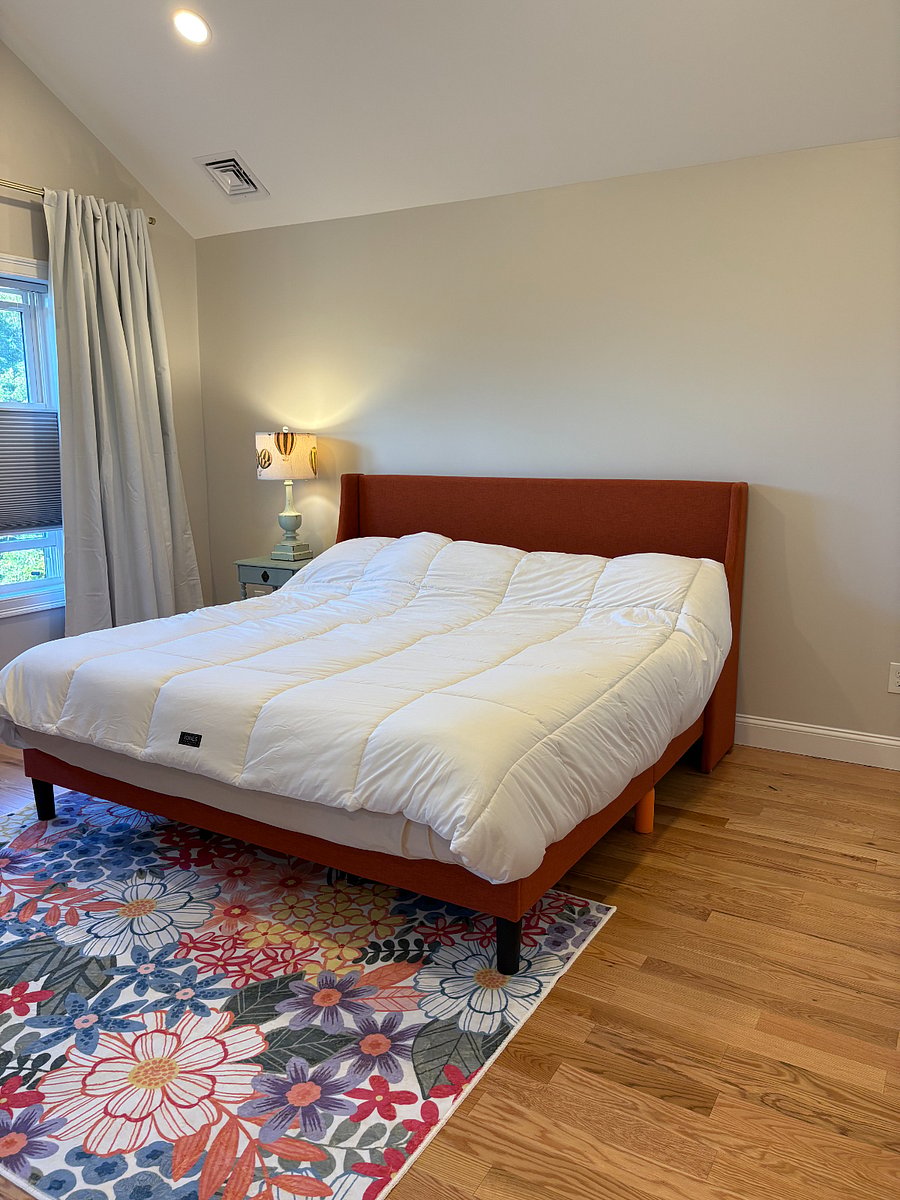 Primary bedroom - King size bed, black out shades, black out curtains. View from entrance door