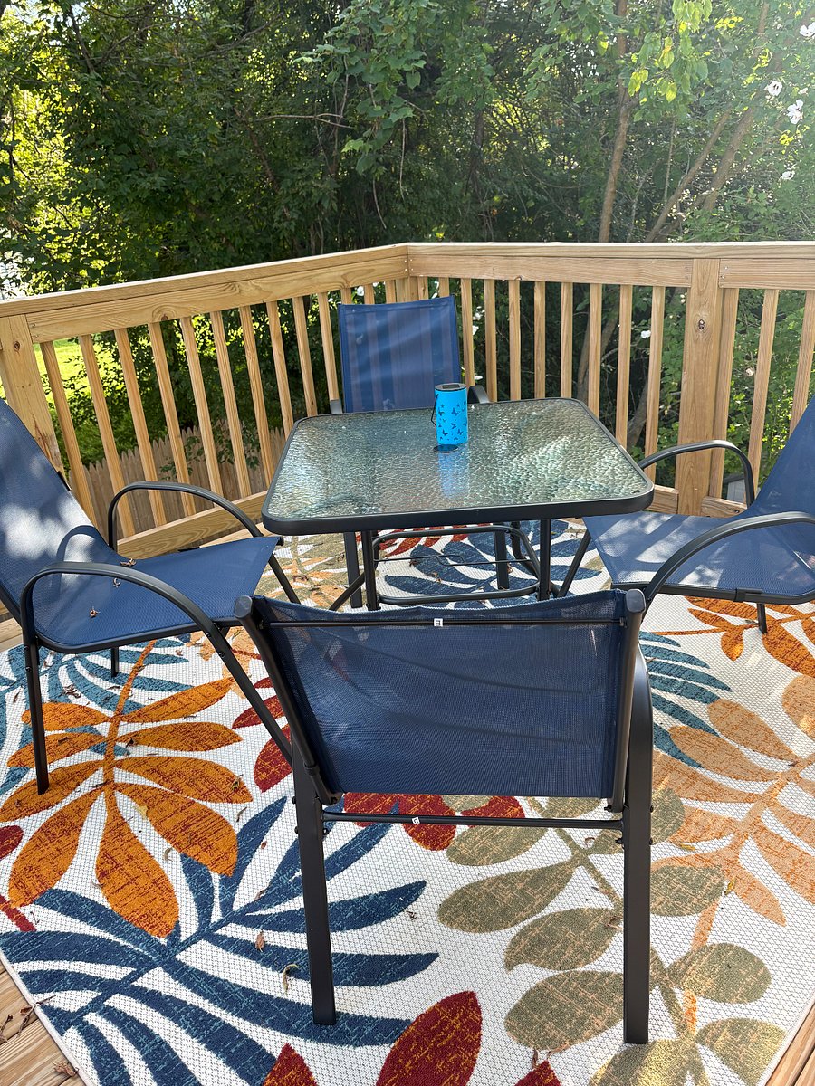 Deck with table and seating for 4. Rug not present October - April