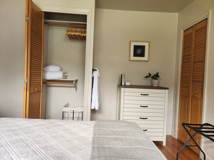 Bedroom 3 (closet includes extra sheets, blanket, hamper, wood hangers, and luggage rack)