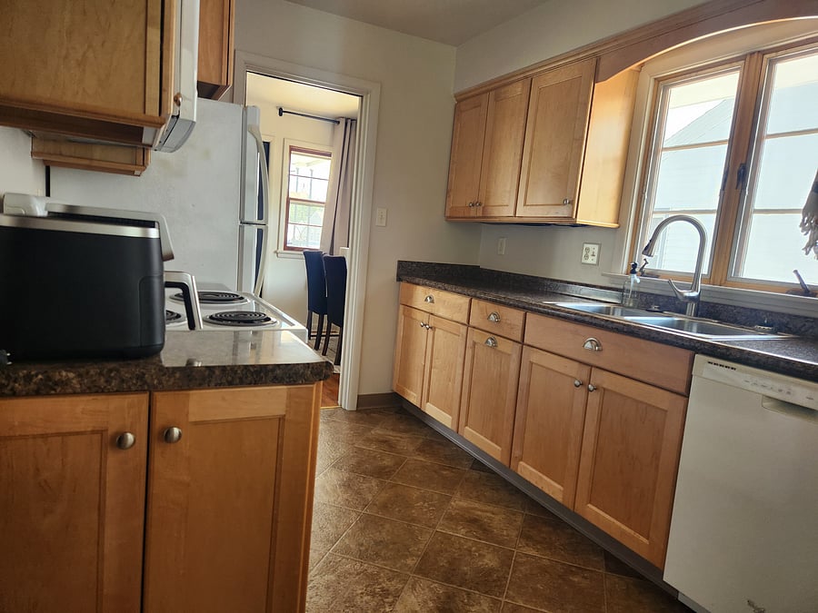 Full kitchen (fridge, microwave, oven, and dishwasher, dishes, pots/pans, air fryer, 2 types of coffee pots (standard drip and Kuerig), and starter supplies)