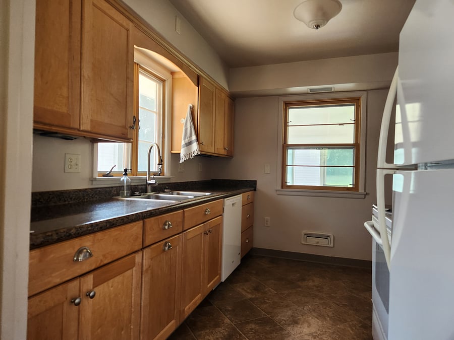 Full kitchen (fridge, microwave, oven, and dishwasher, dishes, pots/pans, air fryer, 2 types of coffee pots (standard drip and Kuerig), and starter supplies)