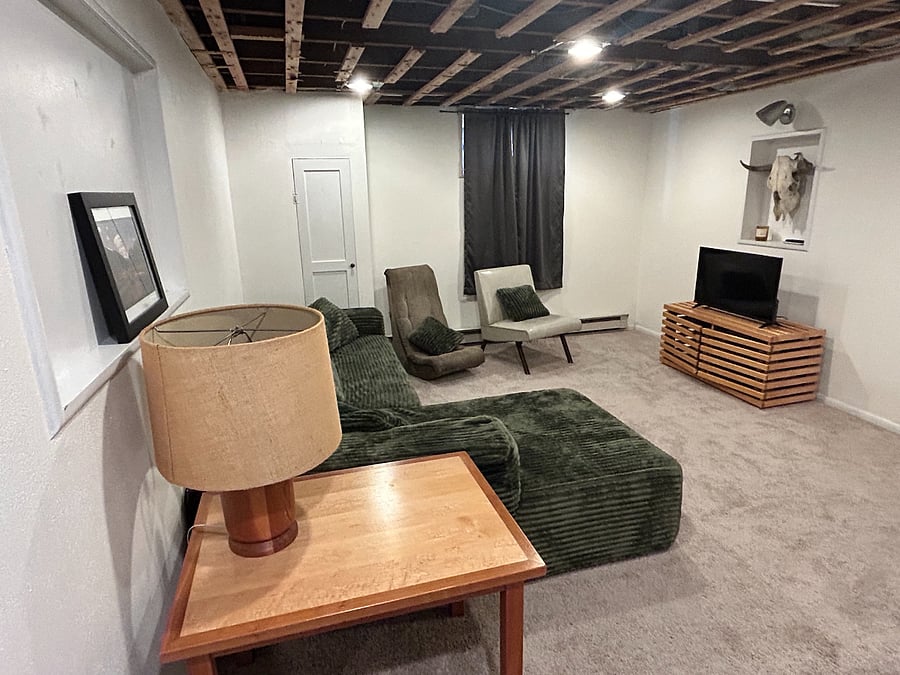 Basement Living room/Flex space. Boneless sofa with chaise lounge, individual seating, Samsung 32" Smart TV with Roku.