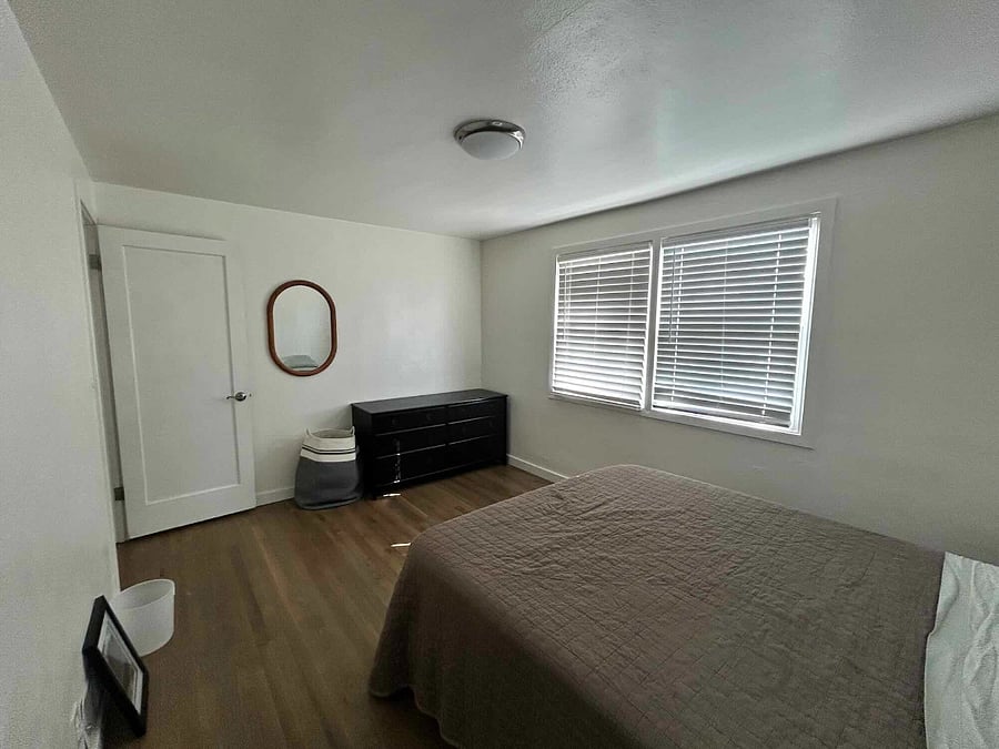 Large bedroom wit Queen sized bed. Sheets and blankets provided. Night stands, 6 drawer dresser, closet with hangers, and hanging wall mirror also included.