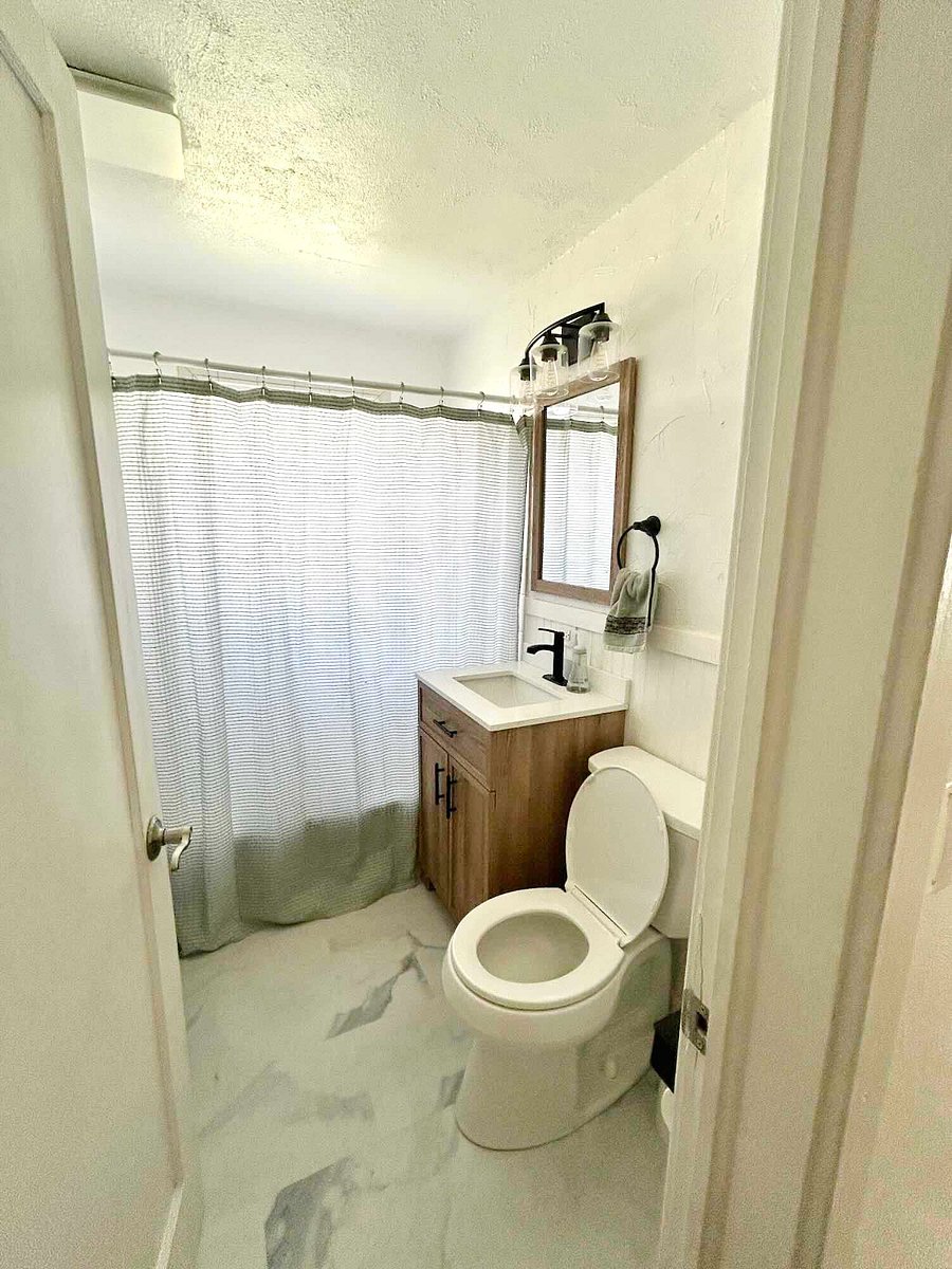 Bathroom with full size tub, ultra quiet exhaust fan, and all the amenities you'd expect. 