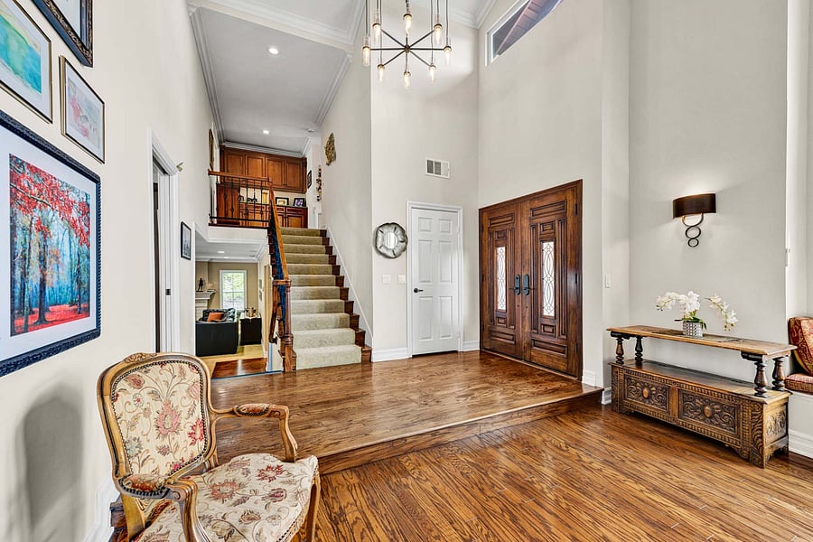 Many family photos have been taken on those stairs, custom chandelier is nice, and the high ceilings are spectacular!
