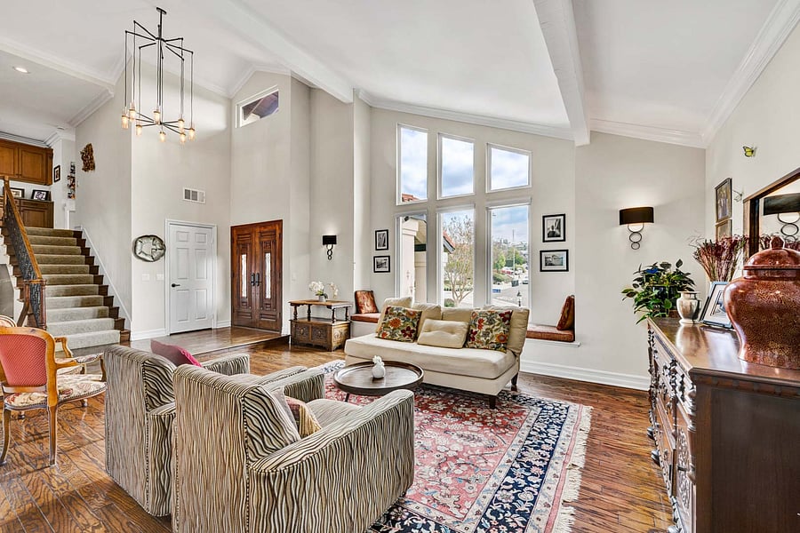 The other angle of your fantastic Family Room for entertaining, relaxing, reading, or just taking in the view from your massive "Wall of Windows".