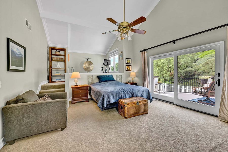 Here is your PALATIAL Master Bedroom with retreat and exercise room up the stairs! Lit Ceiling fan along with access to your private upstairs balcony.
