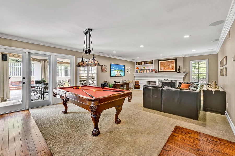 That is a medium sized "Beach" Pool table
and can be the center piece of this beautiful game/tv room.