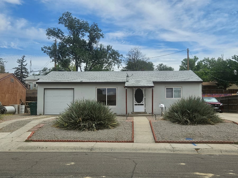 Front view with garage on left.