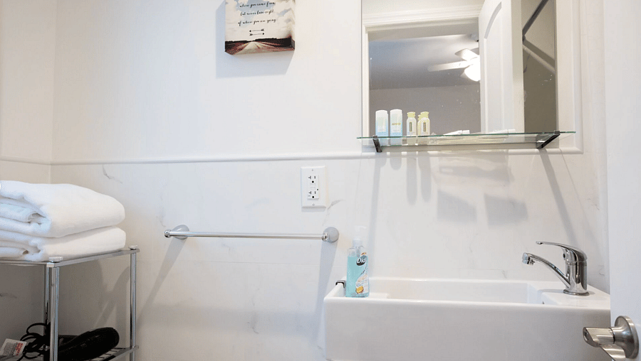 Modern bathroom stocked with fresh towels.