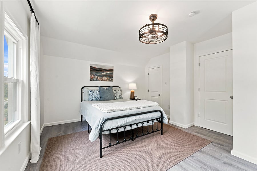 Front bedroom, fully furnished, with access to the finished attic.