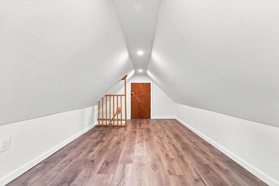 Finished attic can be used as additional storage or workspace.