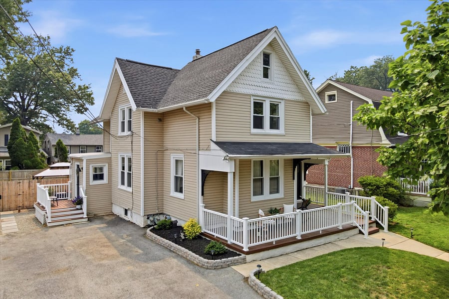 Exterior front of house with two reserved private driveway parking spots.