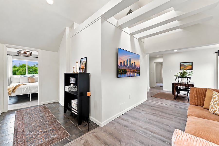 Living room with vaulted ceilings and tons of natural light.