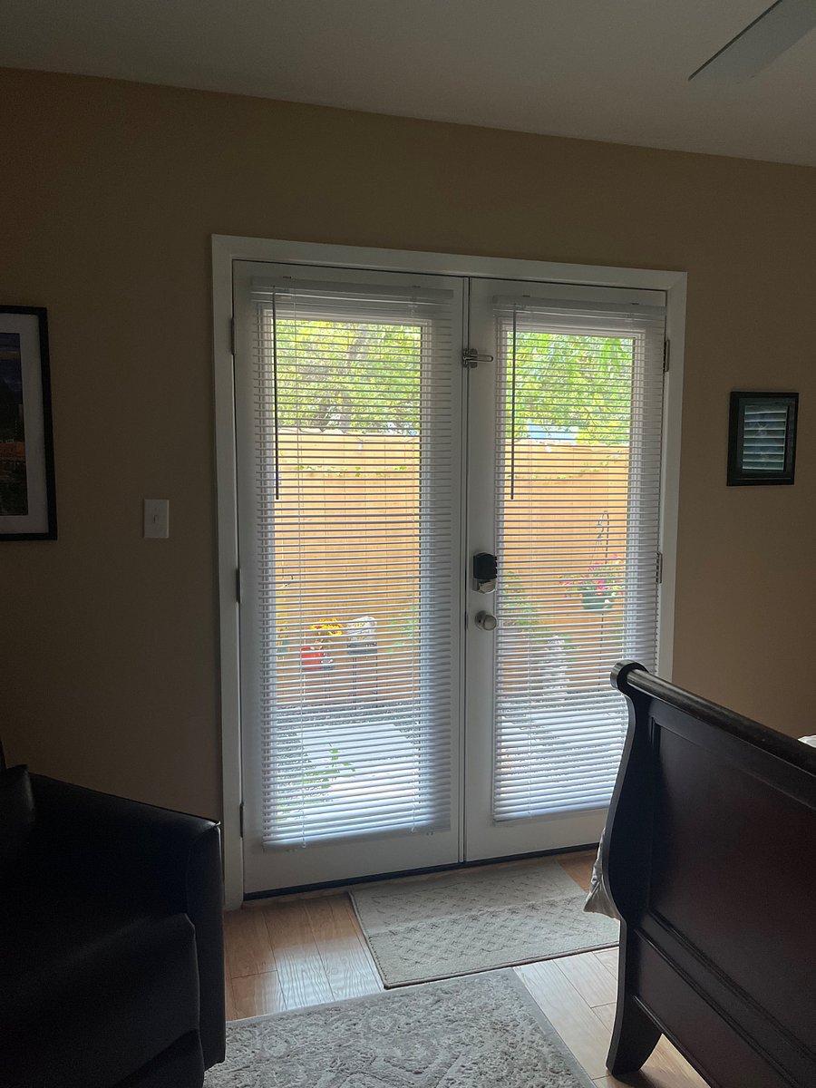 French doors leading to private, enclosed patio with Zen fountain. 