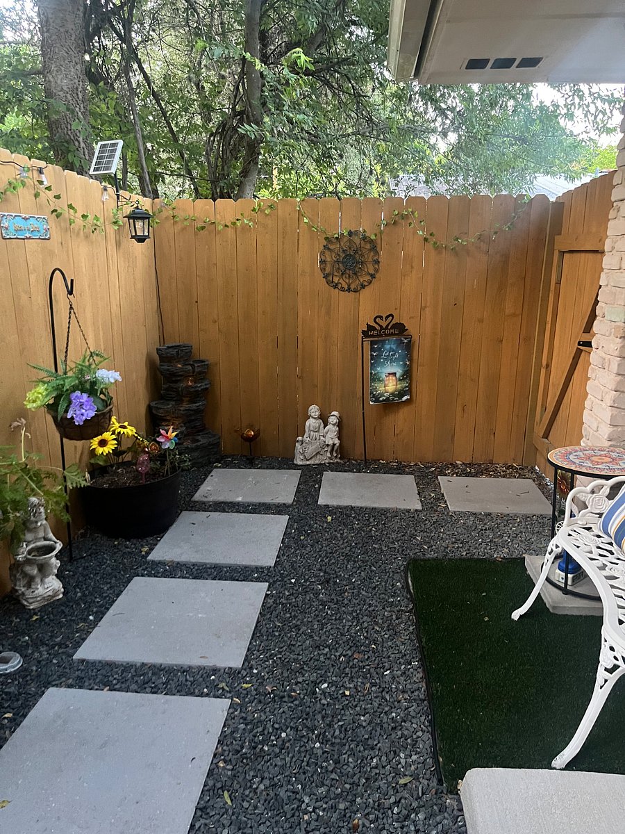 View of patio with Zen fountain and greenery.