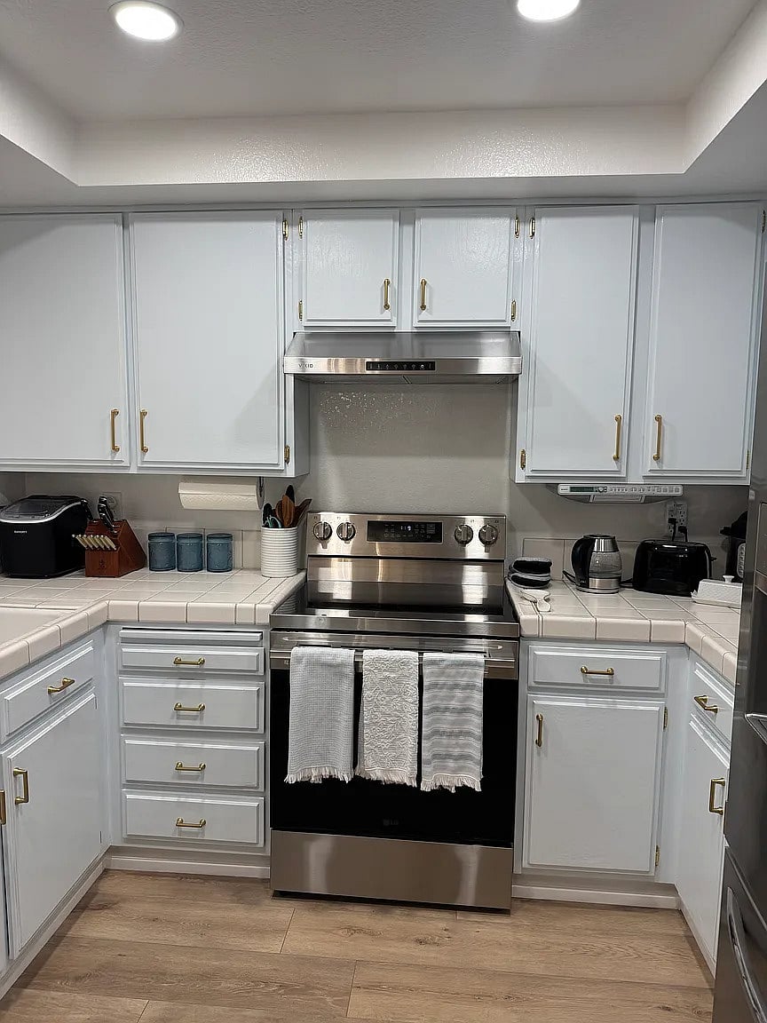Kitchen with new oven and dishwasher and equip with absolutely everything from blender to fondue pots!
