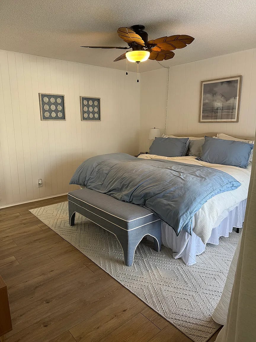 Master bedroom with king bed, smart TV, down comforters and pillows, as well as down alternative comforters and pillows.