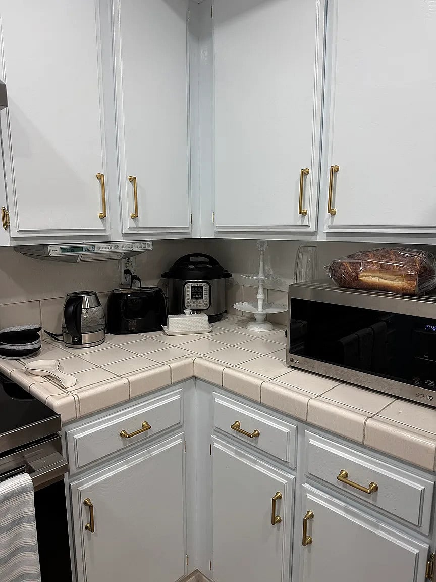 Kitchen with new oven and dishwasher and equip with absolutely everything from blender to fondue pots!