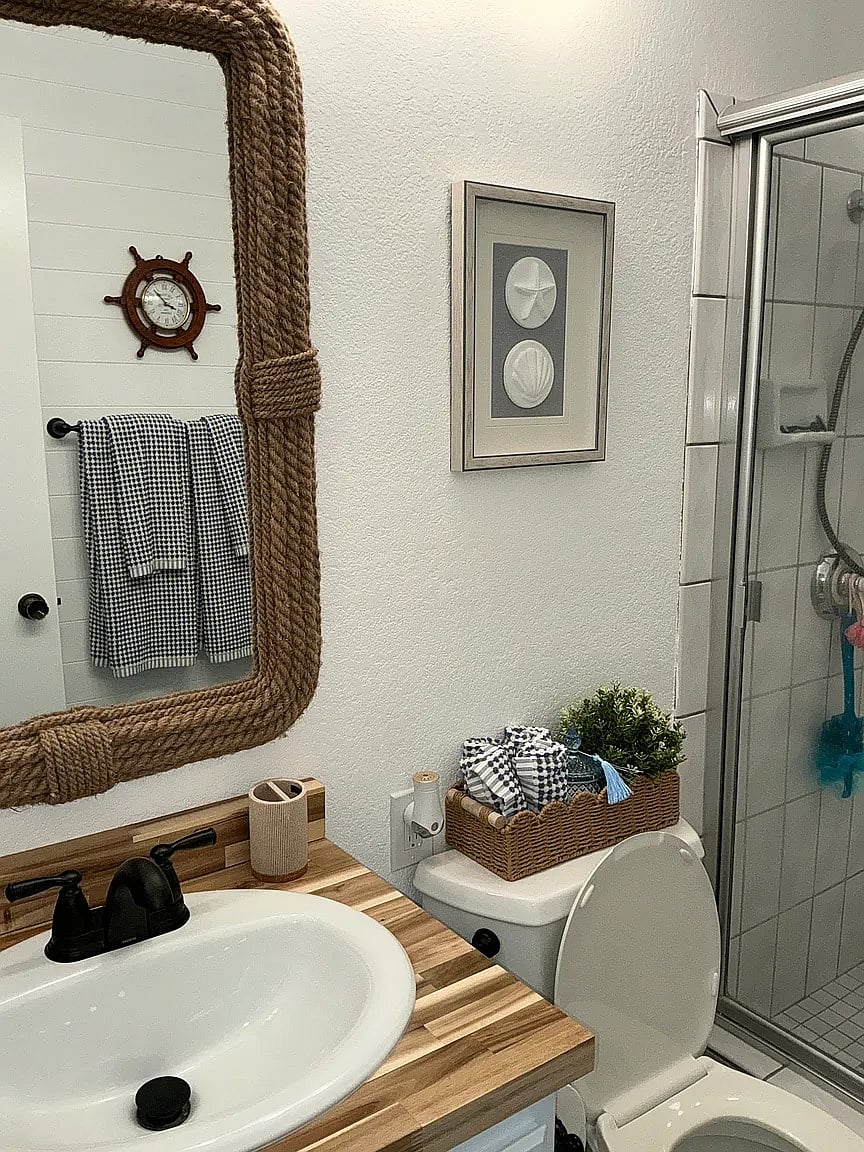 Front Bathroom supplied with shampoo, conditioner, body wash, tooth brushes, brush, and blow dryer.