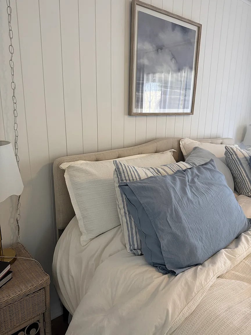 Master bedroom with king bed, smart TV, down comforters and pillows, as well as down alternative comforters and pillows.