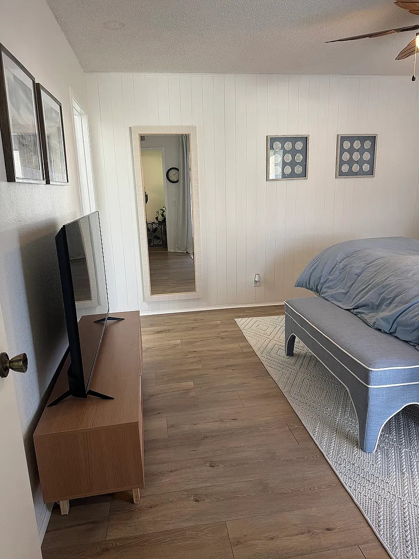 Master bedroom with king bed, smart TV, down comforters and pillows, as well as down alternative comforters and pillows.