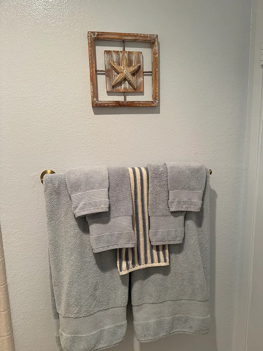 Master bath with walk-in closet, two sinks, shower, and large bathtub! Well appointed with hangers in closet, shampoo, conditioner, body wash, tooth brushes, brush, and blow dryer.