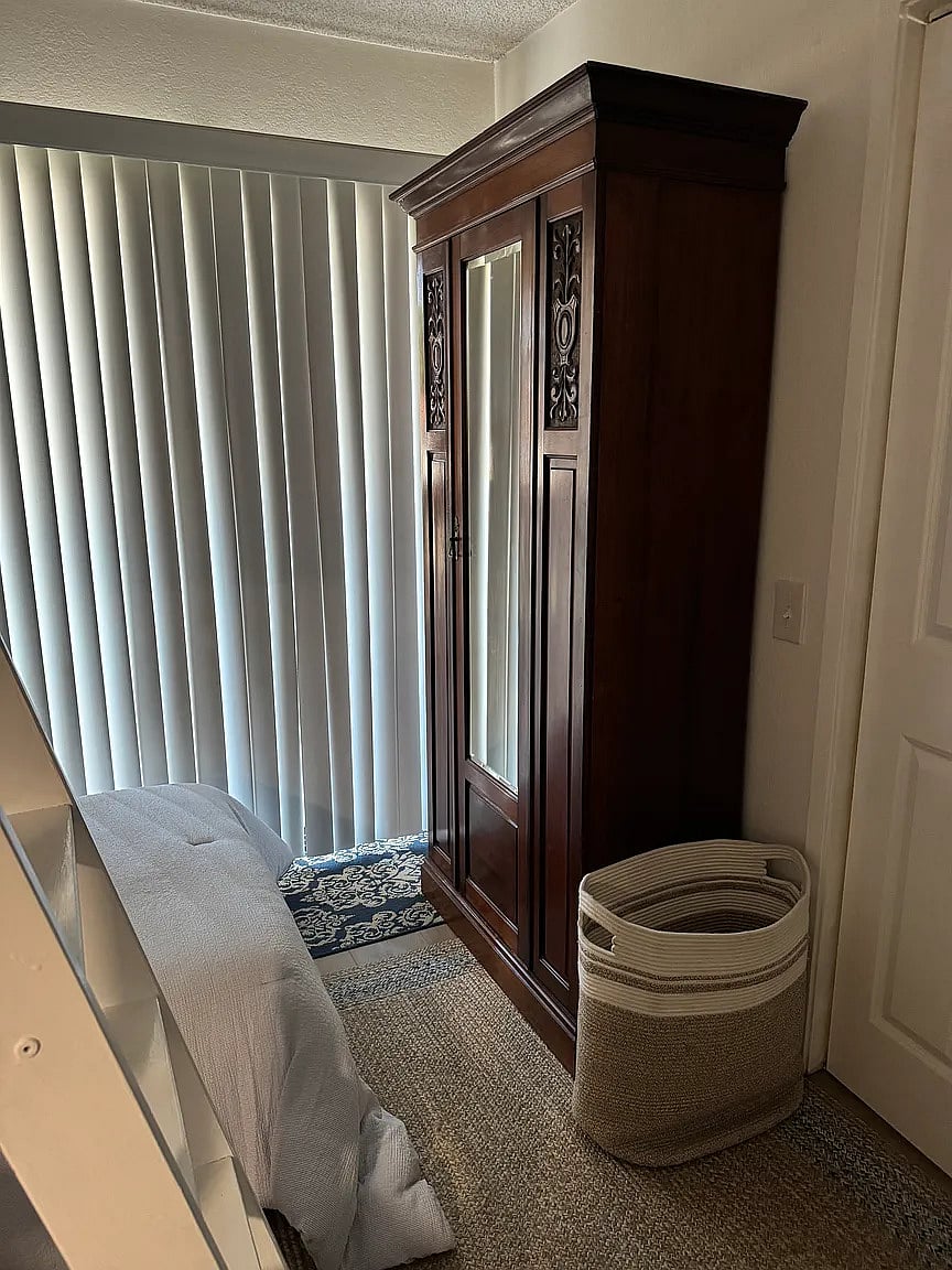 Third bedroom with full loft bed, twin bed, reading nook, and armoire. Enjoy playing video games on the video cocktail table!