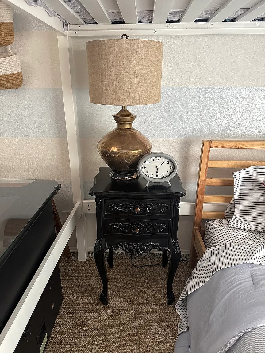 Third bedroom with full loft bed, twin bed, reading nook, and armoire. Enjoy playing video games on the video cocktail table!