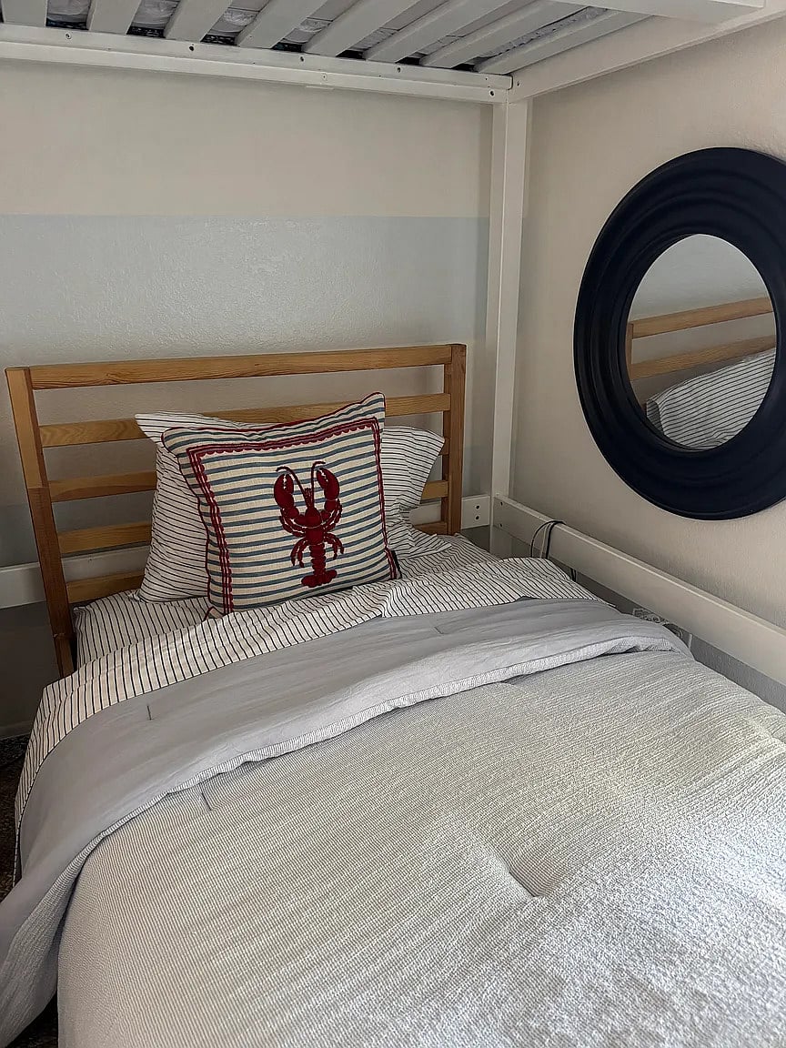 Third bedroom with full loft bed, twin bed, reading nook, and armoire. Enjoy playing video games on the video cocktail table!