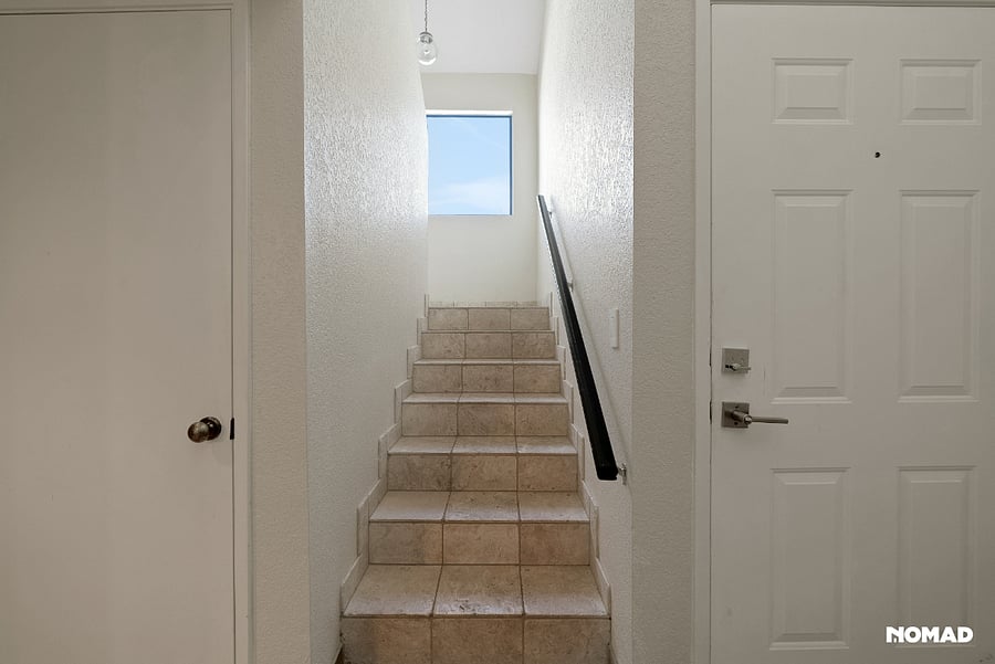 Stairway , facing east leading to main living area and kitchen