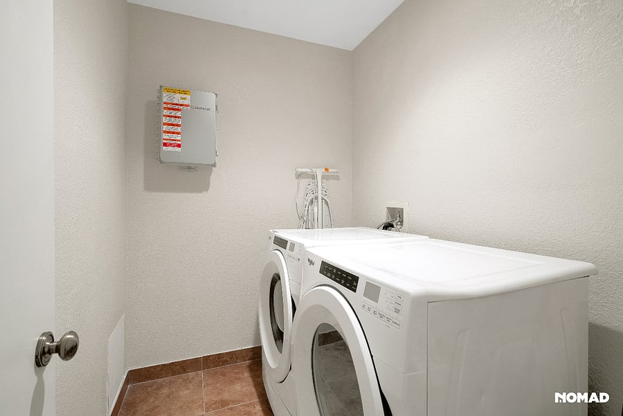 Front loading washer and dryer in unit, with timer for venting, quite fan