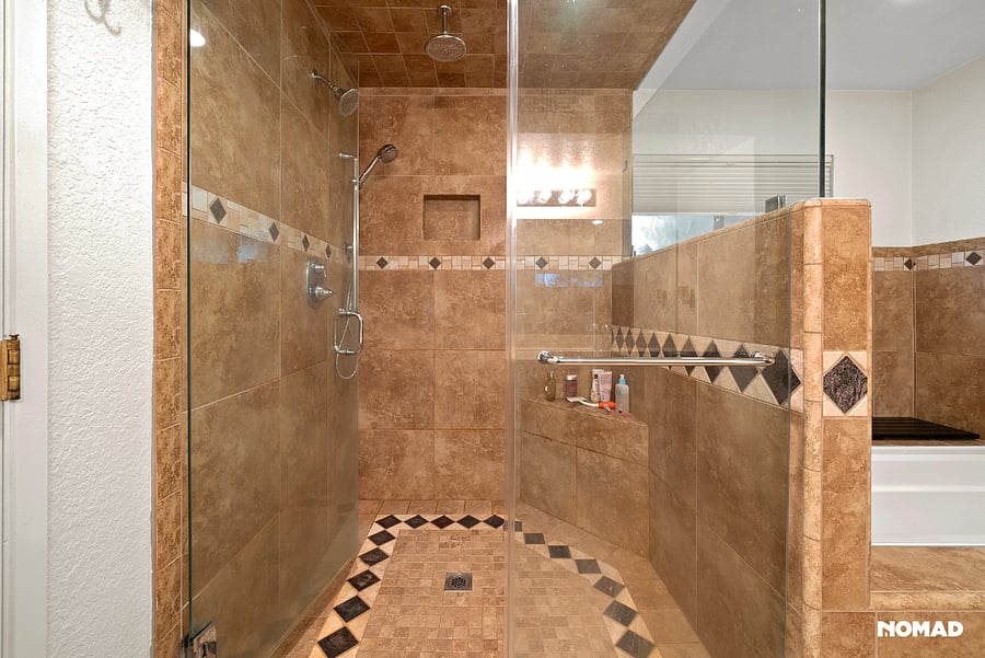 Extra large shower, with rain overhead fixture, hand wand and main spray.