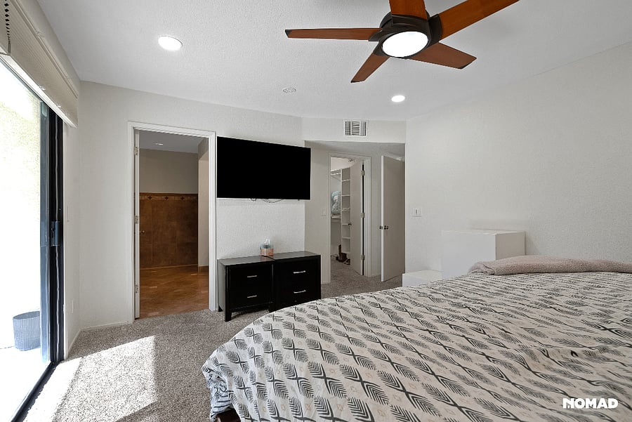 Main bedroom facing south view, it has six speed programable for start stop times and speeds by Casa Blanca, with black shades, top down bottom up features for light view control