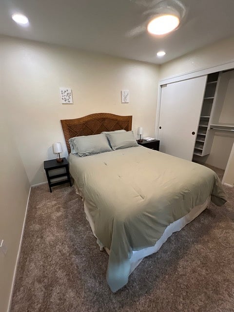 Third guest bedroom, with programable casa blanca ceiling fan, floating shelf closet organizer with clear floor space for luggage etc.