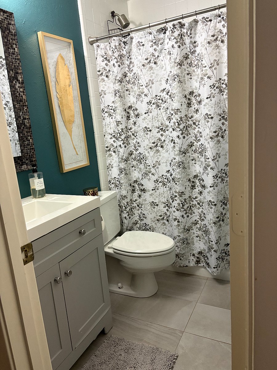 Second bathroom with bathtub.