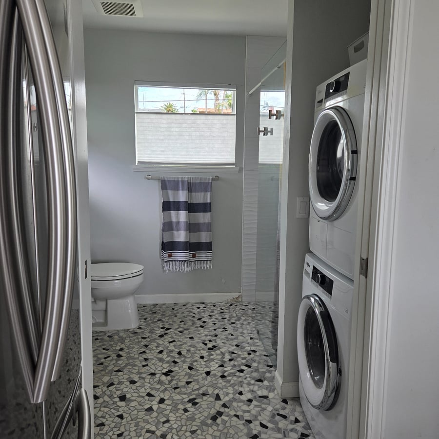 Private Bath, walk in shower on the other side of washer/dryer