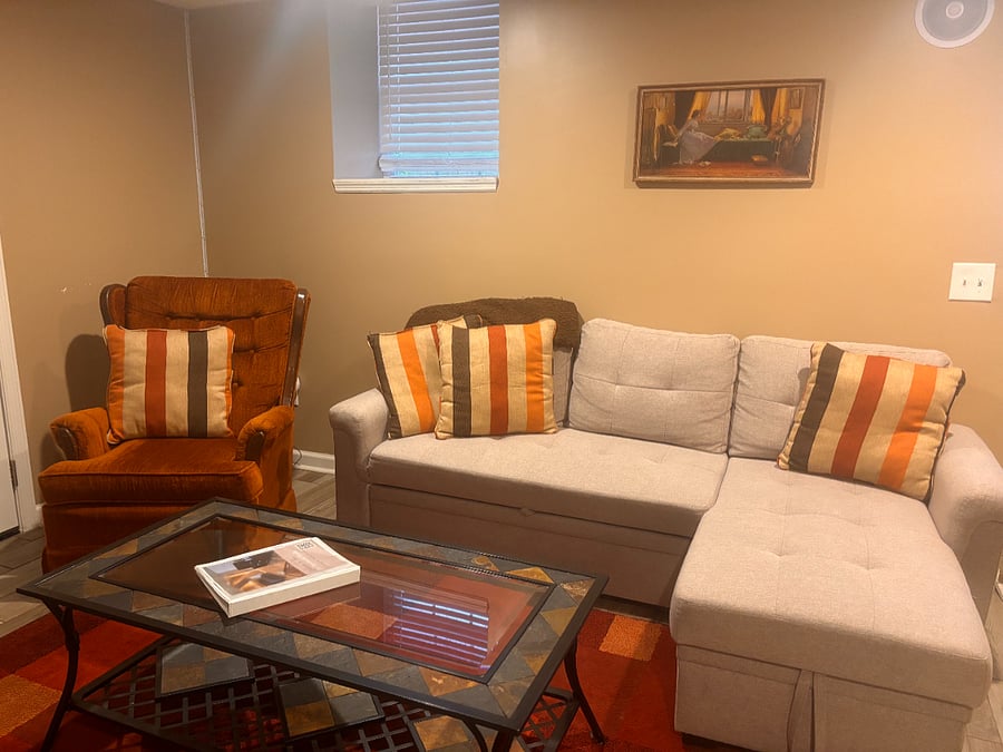 The cozy sitting area in the suite is furnished with a legitimate retro rocking chair from 1984