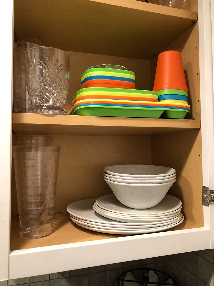 The kitchenette is appointed with plates, cups, wine glasses, and kids utensils and plates. These items can be kept or moved for more pots/pans and cooking tools if desired