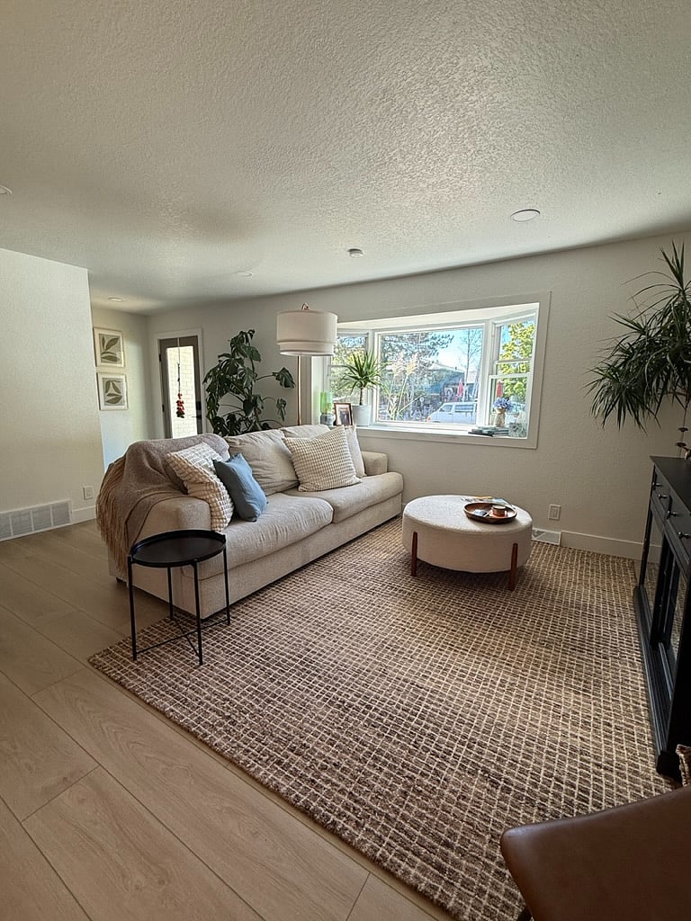 Cozy living room with bay window sunshine.