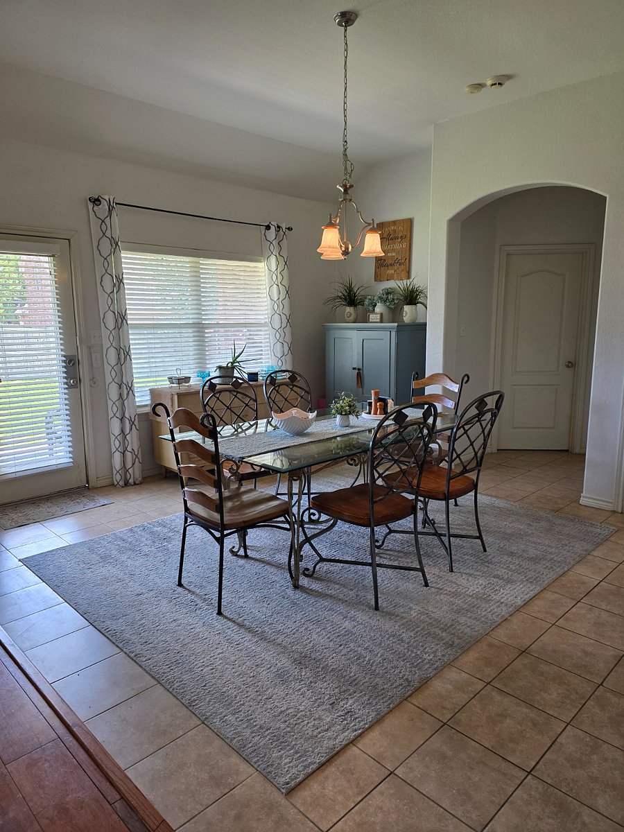 Dining Area that leads to kitchen and Laundry Rm, and Back Covered Porch.
